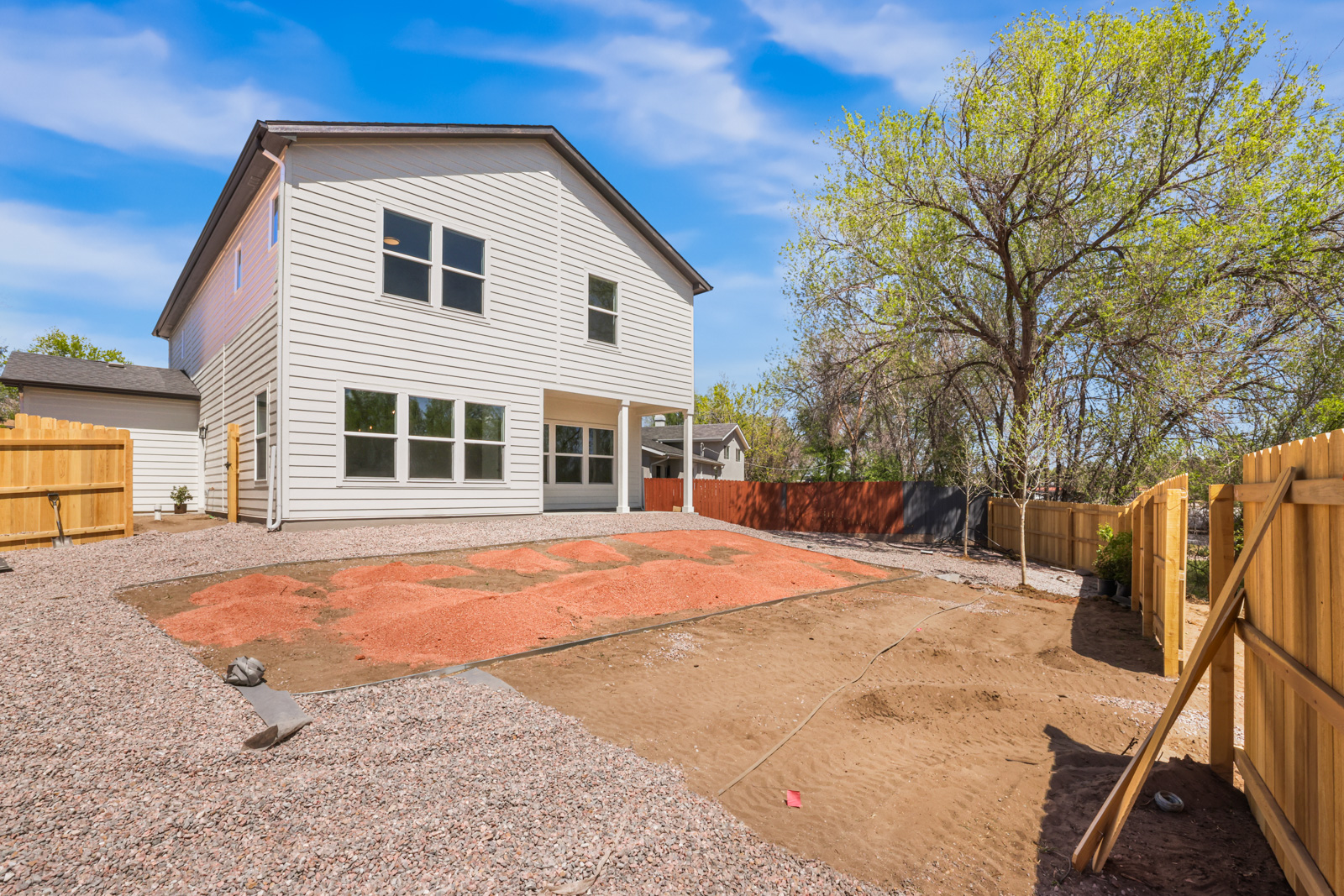 Lander rear exterior with covered patio and fenced backyard