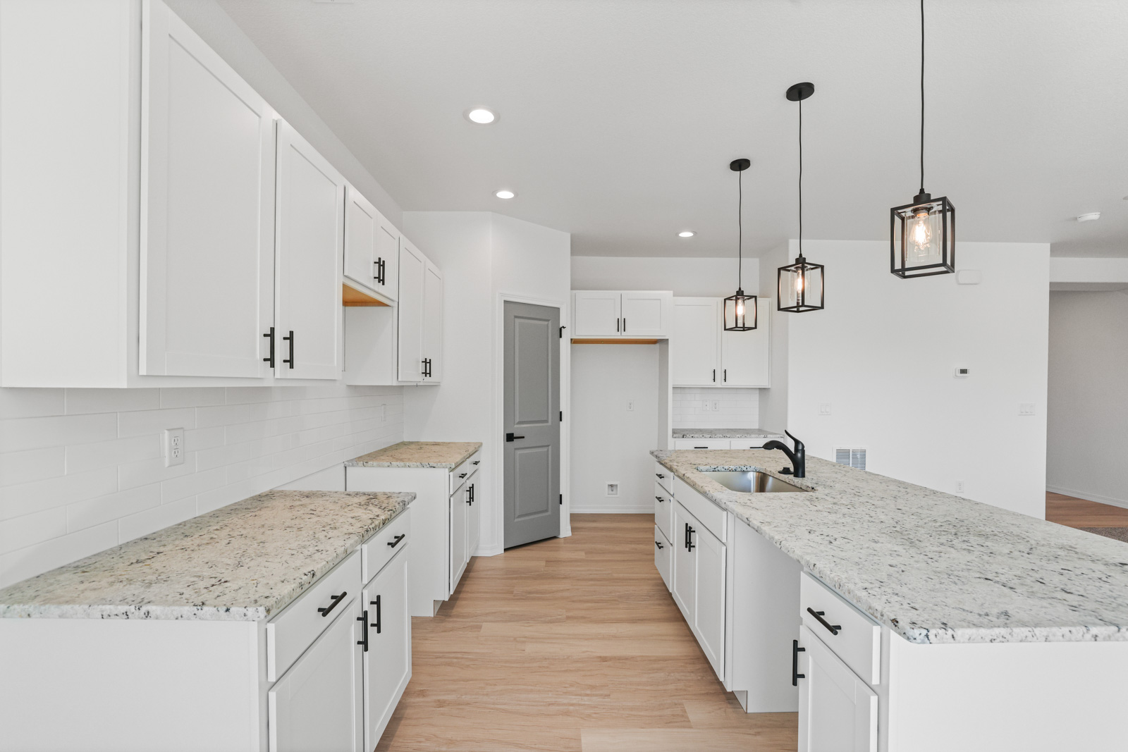 Lander kitchen granite countertops and shaker cabinetry