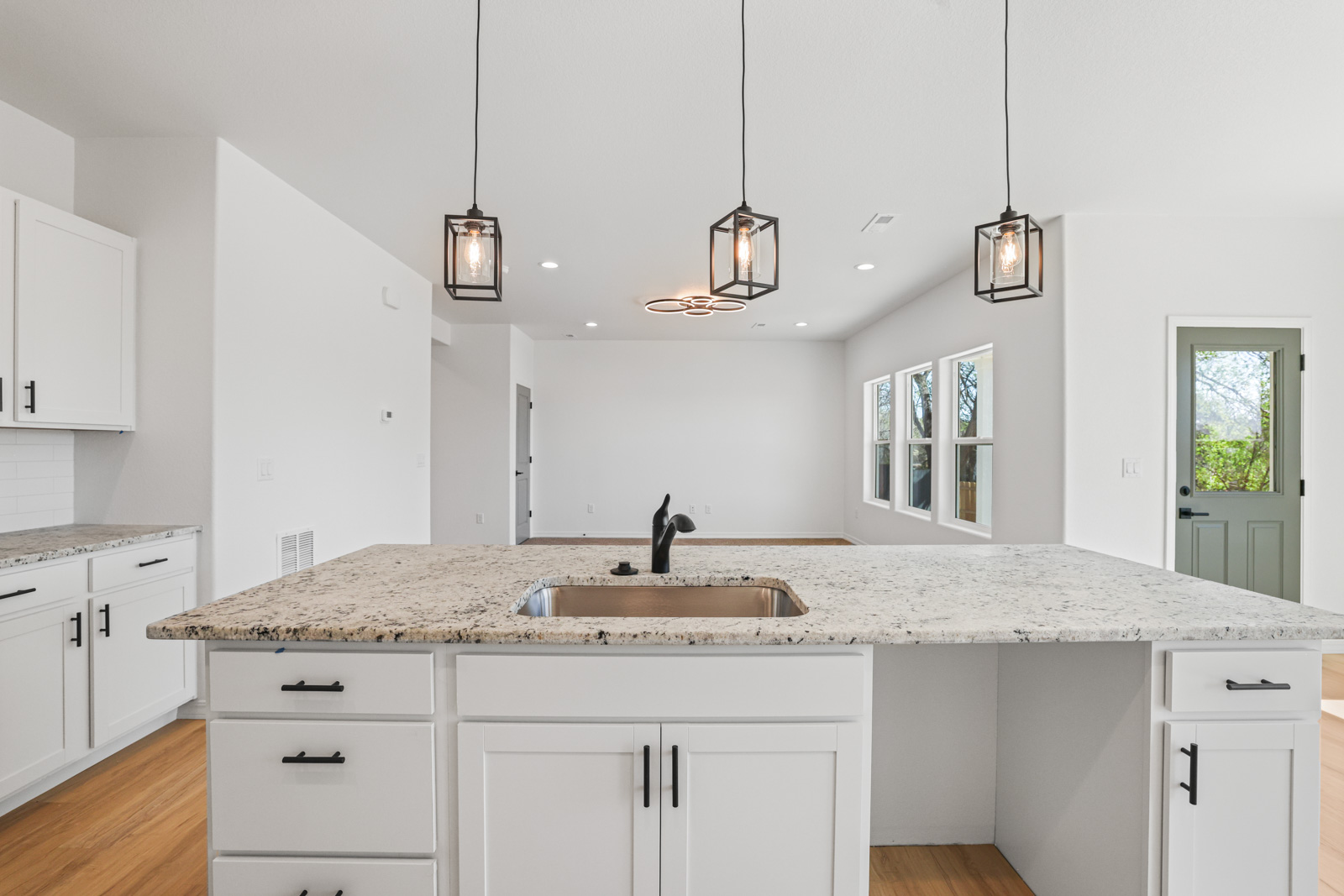 Lander kitchen detail with pendant lights and granite